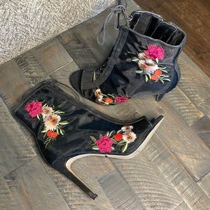 Black booties with flower embellishments